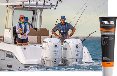 Two people fishing on a boat that features two Yamaha outboards.