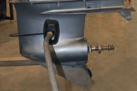 A garden hose connected to the outboard for the flush muff method of fresh water flushing.