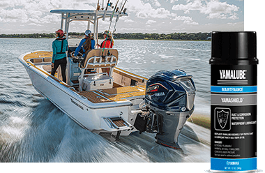 Three boaters on a Yamaha-powered boat with a can of Yamalube Yamashield in the foreground.